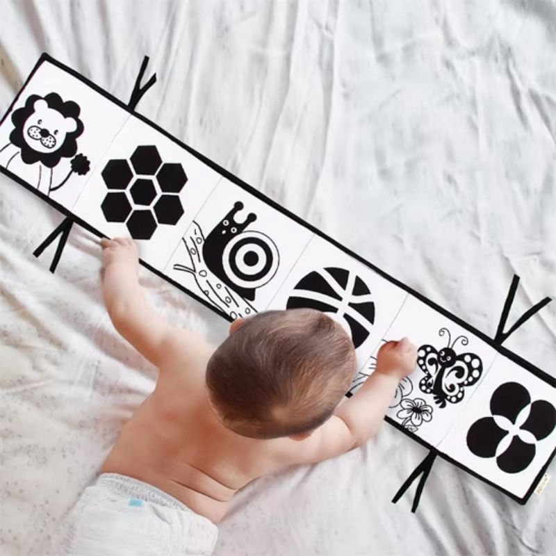 Busy Board Bébé : Le Livre d'Éveil en Tissu - BABYSBLOU